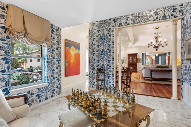 3012 Wood Lake Dr, Waco, TX 76710 - living area featuring marble finish floors, wallpapered walls, baseboards, a chandelier, and decorative columns
