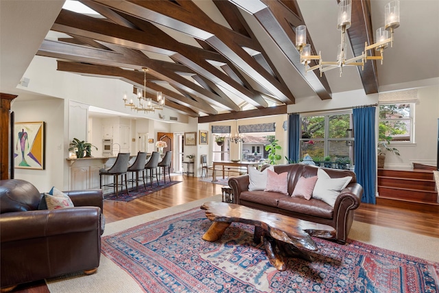 3012 Wood Lake Dr, Waco, TX 76710 - living area with a chandelier, beamed ceiling, wood finished floors, and high vaulted ceiling