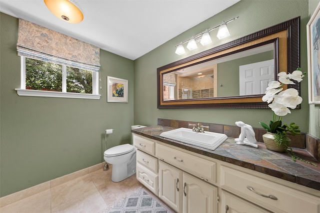 3012 Wood Lake Dr, Waco, TX 76710 - bathroom featuring vanity, toilet, baseboards, tile patterned floors, and a shower