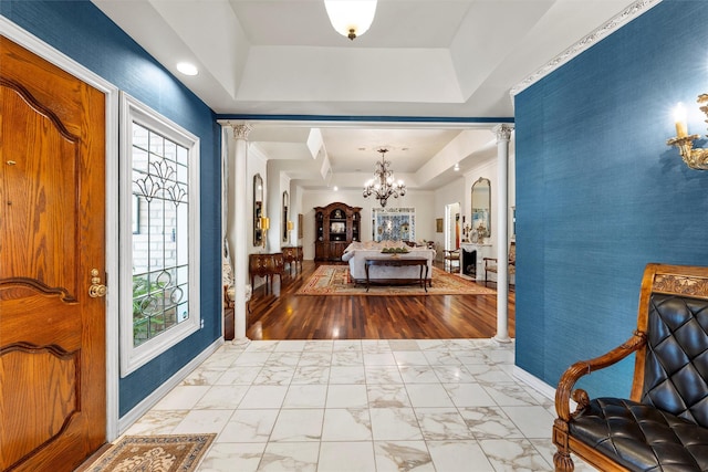 3012 Wood Lake Dr, Waco, TX 76710 - foyer with decorative columns, marble finish flooring, a chandelier, baseboards, and a tray ceiling