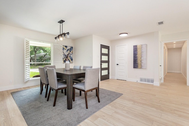7818 Rolling Acres Dr, Dallas, TX 75248 - dining area with light wood-type flooring and baseboards