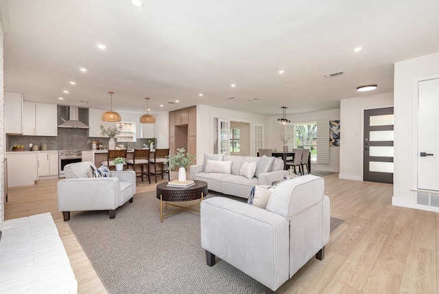7818 Rolling Acres Dr, Dallas, TX 75248 - living area with recessed lighting, light wood-style floors, and baseboards