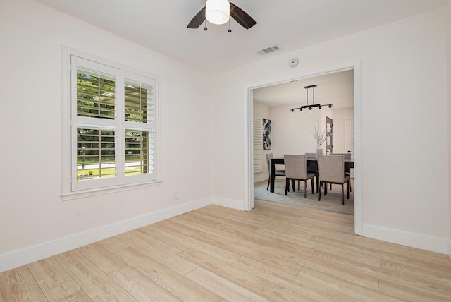 7818 Rolling Acres Dr, Dallas, TX 75248 - unfurnished room featuring a ceiling fan, wood finished floors, and baseboards