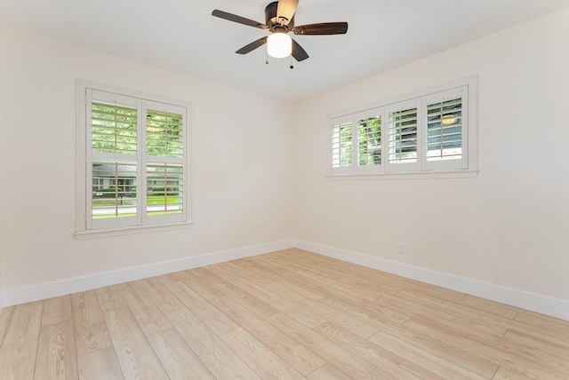 7818 Rolling Acres Dr, Dallas, TX 75248 - unfurnished room with healthy amount of natural light, wood finished floors, baseboards, and a ceiling fan