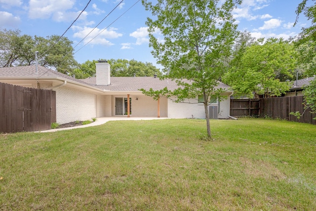 7818 Rolling Acres Dr, Dallas, TX 75248 - rear view of house featuring brick siding, a patio area, and a chimney