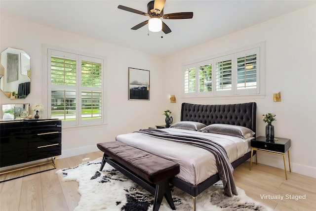 7818 Rolling Acres Dr, Dallas, TX 75248 - bedroom featuring multiple windows, baseboards, light wood-type flooring, and a ceiling fan