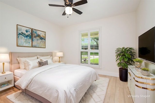 7818 Rolling Acres Dr, Dallas, TX 75248 - bedroom with light wood-type flooring, baseboards, and a ceiling fan