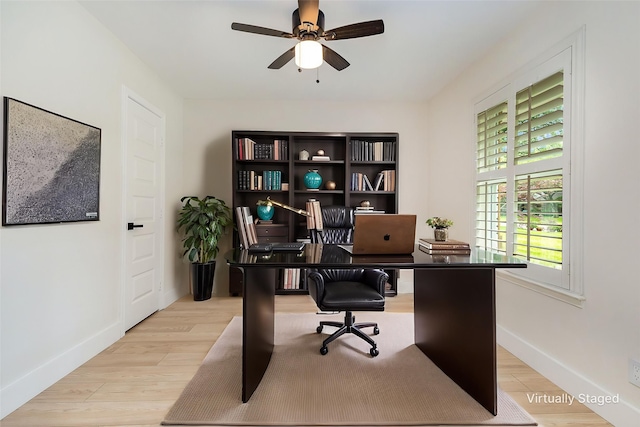 7818 Rolling Acres Dr, Dallas, TX 75248 - home office with ceiling fan, baseboards, and wood finished floors