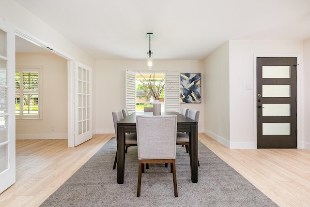 7818 Rolling Acres Dr, Dallas, TX 75248 - dining space with wood finished floors, healthy amount of natural light, and baseboards