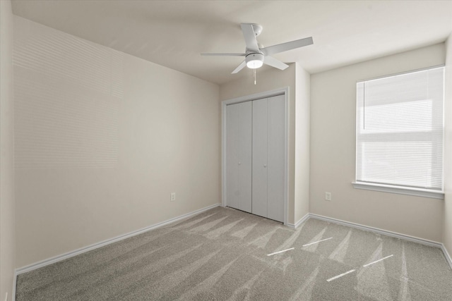 2311 Markland St, Irving, TX 75060 - unfurnished bedroom with light colored carpet, a closet, baseboards, and ceiling fan