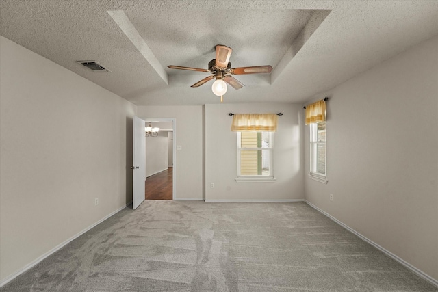 2311 Markland St, Irving, TX 75060 - unfurnished room featuring a textured ceiling, a ceiling fan, a chandelier, carpet, and baseboards