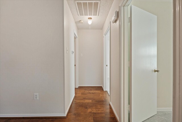 2311 Markland St, Irving, TX 75060 - hallway featuring wood finished floors, baseboards, and a textured ceiling