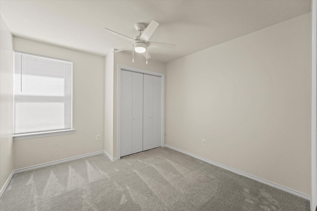 2311 Markland St, Irving, TX 75060 - unfurnished bedroom featuring light carpet, baseboards, a closet, and ceiling fan