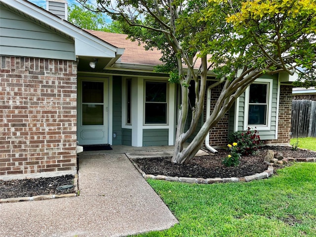 617 Reed St, Roanoke, TX 76262 - doorway to property with brick siding, a chimney, and a shingled roof