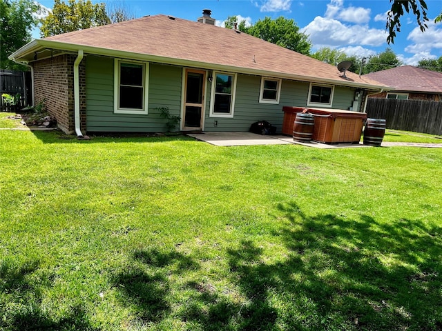 617 Reed St, Roanoke, TX 76262 - rear view of property featuring a hot tub, a patio area, and a chimney