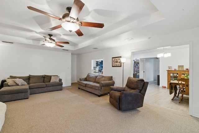 213 Lacewell St, Jacksboro, TX 76458 - carpeted living room with a tray ceiling and ceiling fan