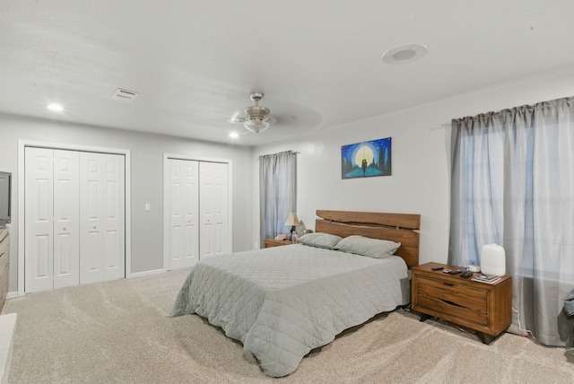 213 Lacewell St, Jacksboro, TX 76458 - carpeted bedroom with two closets, a ceiling fan, baseboards, and recessed lighting