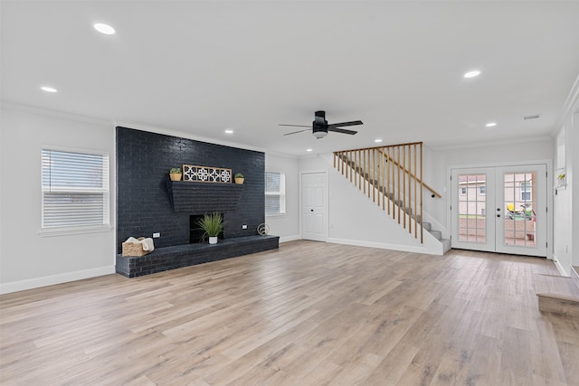 16030 Saint Paul Dr, Caney City, TX 75148 - unfurnished living room with healthy amount of natural light, a ceiling fan, ornamental molding, stairway, and light wood finished floors
