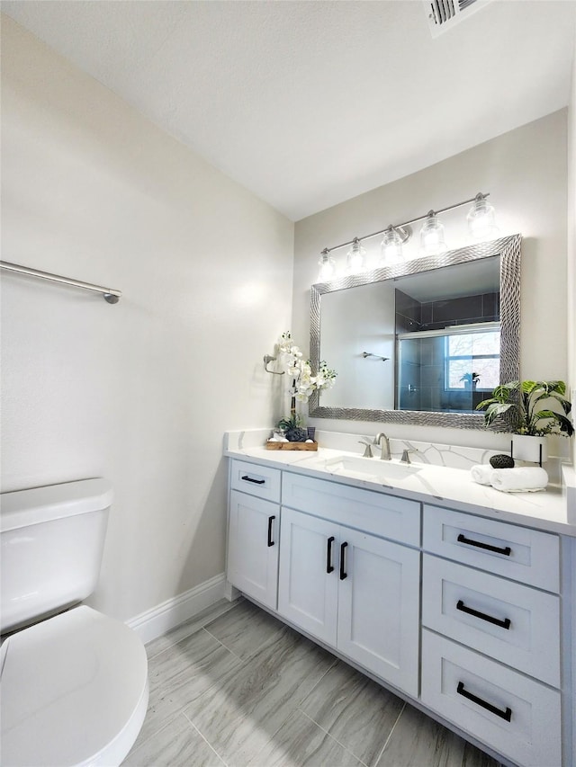 16030 Saint Paul Dr, Caney City, TX 75148 - bathroom with vanity, toilet, a shower stall, and baseboards