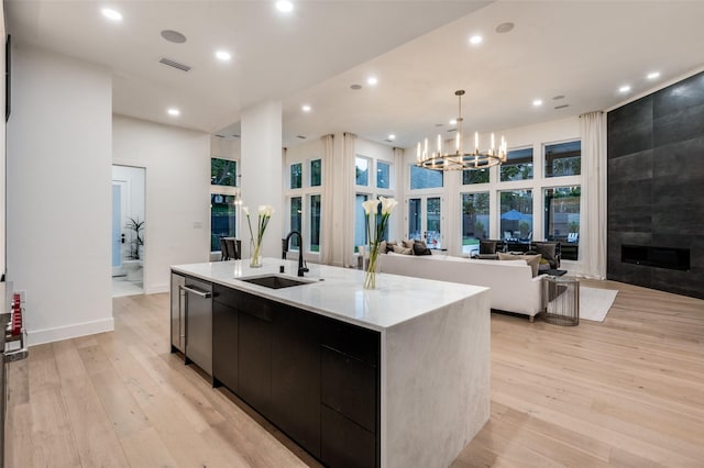 6075 Jordan Way, Frisco, TX 75034 - kitchen with a sink, an island with sink, modern cabinets, open floor plan, and recessed lighting