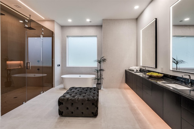 6075 Jordan Way, Frisco, TX 75034 - bathroom with a stall shower, double vanity, a soaking tub, tile patterned flooring, and recessed lighting