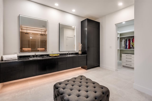 6075 Jordan Way, Frisco, TX 75034 - full bath featuring double vanity, a spacious closet, recessed lighting, walk in shower, and baseboards