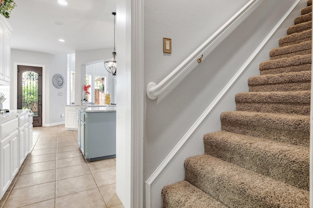 3340 Castlewood Blvd, Highland Village, TX 75077 - stairway with plenty of natural light, tile patterned flooring, recessed lighting, and a chandelier