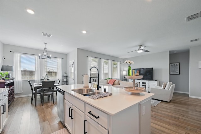 1229 Sequoia Ln, Princeton, TX 75407 - kitchen featuring a sink, stainless steel dishwasher, healthy amount of natural light, light wood finished floors, and recessed lighting