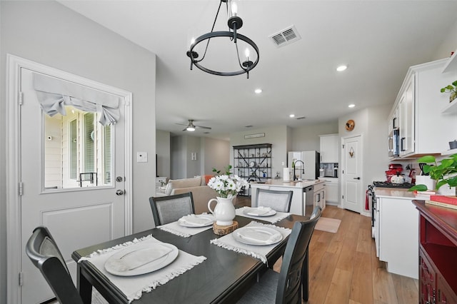 1229 Sequoia Ln, Princeton, TX 75407 - dining area with a chandelier, light wood-style flooring, recessed lighting, and a ceiling fan