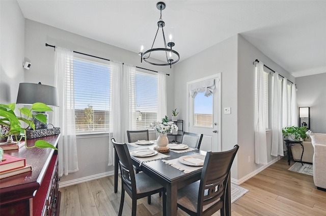 1229 Sequoia Ln, Princeton, TX 75407 - dining room with a chandelier, light wood-style flooring, and baseboards