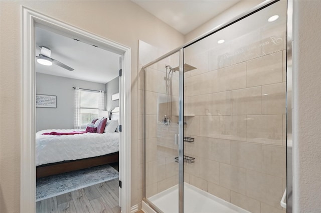 1229 Sequoia Ln, Princeton, TX 75407 - ensuite bathroom featuring a shower stall, wood finished floors, and ceiling fan