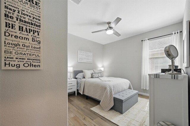 1229 Sequoia Ln, Princeton, TX 75407 - bedroom with wood finished floors and ceiling fan