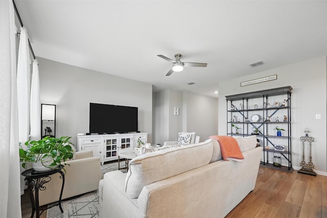 1229 Sequoia Ln, Princeton, TX 75407 - living room with a ceiling fan, baseboards, and light wood-type flooring