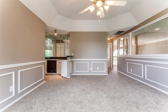 2206 Virginia Ln, Haslet, TX 76052 - unfurnished room with a decorative wall, ceiling fan, carpet flooring, and wainscoting
