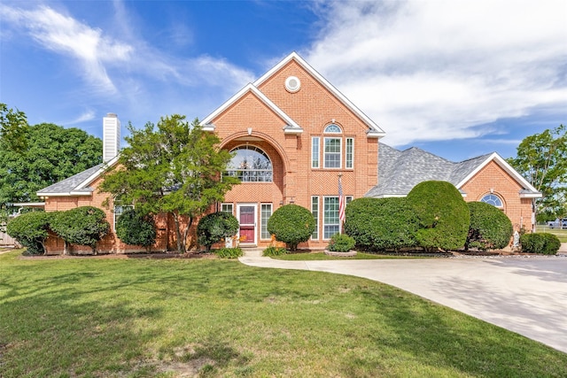 2206 Virginia Ln, Haslet, TX 76052 - view of front of property featuring brick siding, a front yard, and a chimney