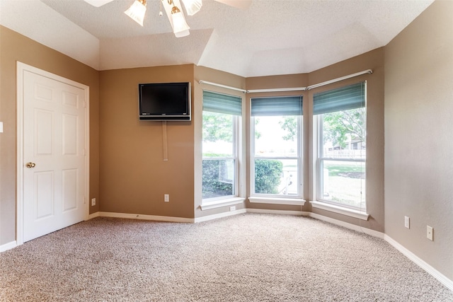 2206 Virginia Ln, Haslet, TX 76052 - carpeted empty room featuring ceiling fan, vaulted ceiling, and baseboards