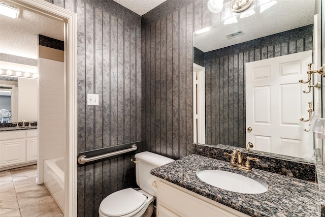 2206 Virginia Ln, Haslet, TX 76052 - full bath featuring a textured ceiling, vanity, toilet, tub / shower combination, and tile patterned floors