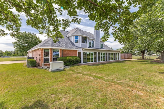 2206 Virginia Ln, Haslet, TX 76052 - back of property featuring a chimney, roof with shingles, and brick siding