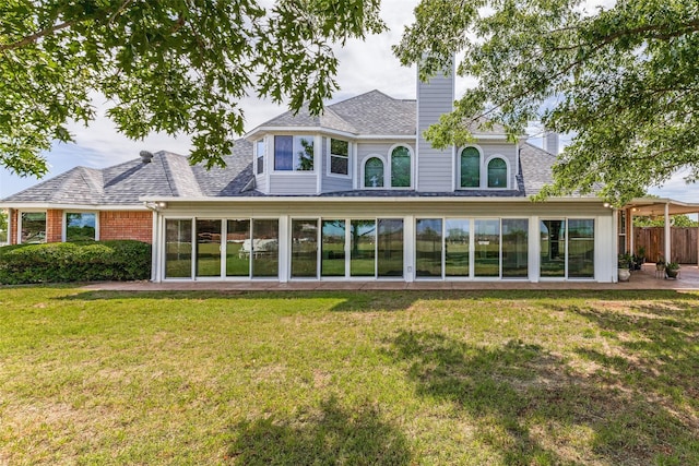 2206 Virginia Ln, Haslet, TX 76052 - back of property with a chimney, a sunroom, and roof with shingles