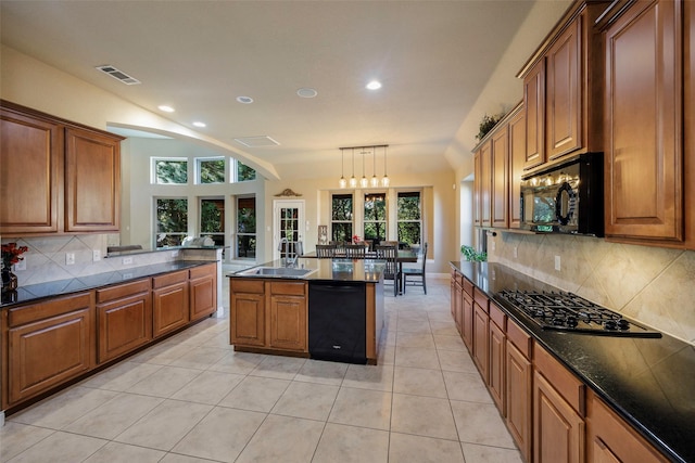 7811 Keith Ln, Sachse, TX 75048 - kitchen with black appliances, brown cabinetry, recessed lighting, a sink, and backsplash