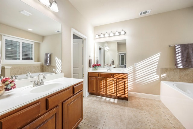7811 Keith Ln, Sachse, TX 75048 - full bathroom featuring a garden tub, two vanities, tile patterned flooring, and baseboards