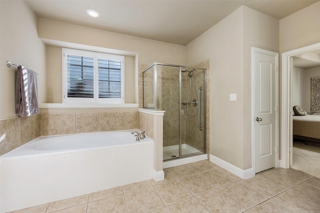 7811 Keith Ln, Sachse, TX 75048 - ensuite bathroom with a bath, tile patterned flooring, a stall shower, and baseboards
