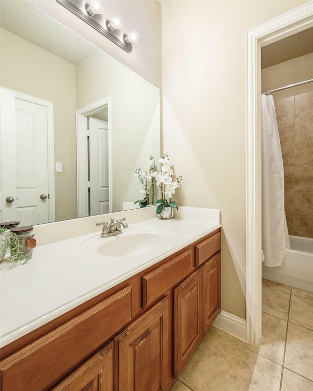 7811 Keith Ln, Sachse, TX 75048 - bathroom with vanity, tile patterned flooring, shower / bath combo, and baseboards