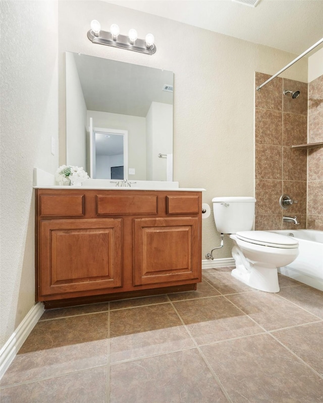 7811 Keith Ln, Sachse, TX 75048 - bathroom with  shower combination, toilet, vanity, baseboards, and tile patterned flooring