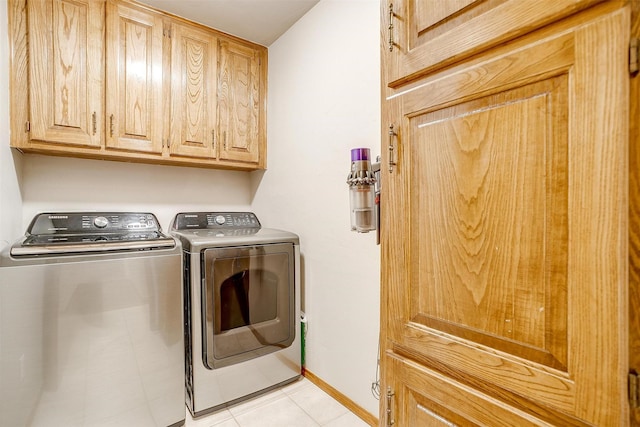 1103 Dirkson St, Weatherford, TX 76086 - laundry room featuring independent washer and dryer, cabinet space, light tile patterned flooring, and baseboards