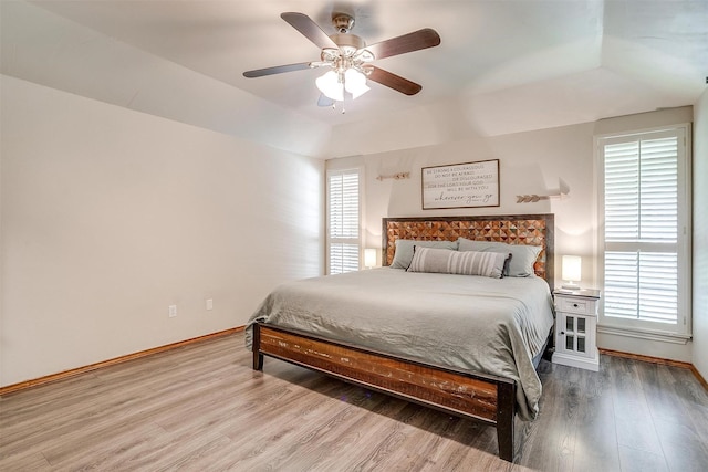1103 Dirkson St, Weatherford, TX 76086 - bedroom featuring wood finished floors, baseboards, ceiling fan, and a raised ceiling