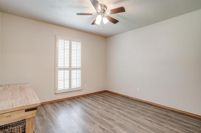 1103 Dirkson St, Weatherford, TX 76086 - spare room with healthy amount of natural light, wood finished floors, a ceiling fan, and baseboards