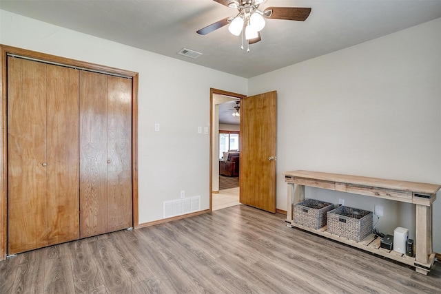 1103 Dirkson St, Weatherford, TX 76086 - unfurnished bedroom featuring wood finished floors, a closet, ceiling fan, and baseboards