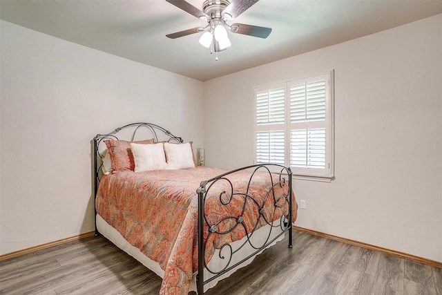 1103 Dirkson St, Weatherford, TX 76086 - bedroom with wood finished floors, baseboards, and a ceiling fan