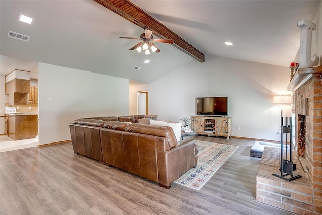 1103 Dirkson St, Weatherford, TX 76086 - living area with ceiling fan, light wood-style flooring, baseboards, and a fireplace